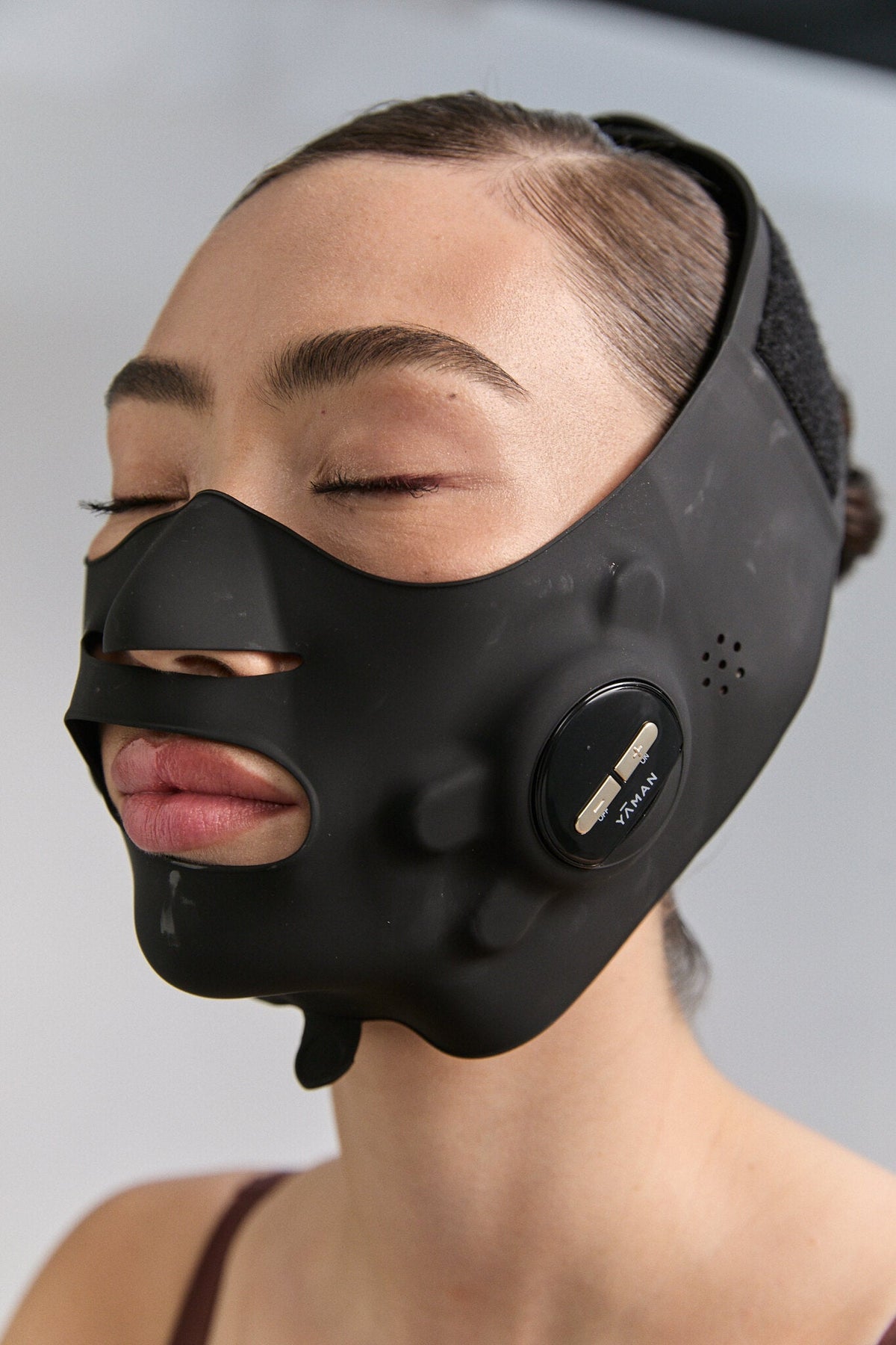 Woman with the Medi Lift PLUS EMS mask