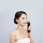 Model holding Photo PLUS Prestige S at her cheek