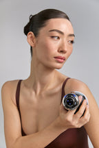 Model holding Cavi Spa RF Core Plus with control dial lit