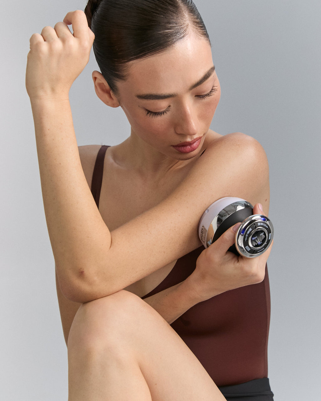 Model using Cavi Spa RF Core Plus on her arm, close view