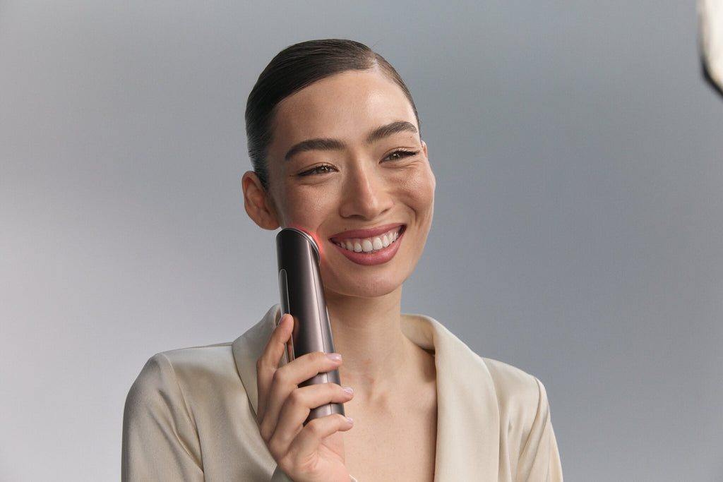 Smiling model holding Photo Plus Deep Lift