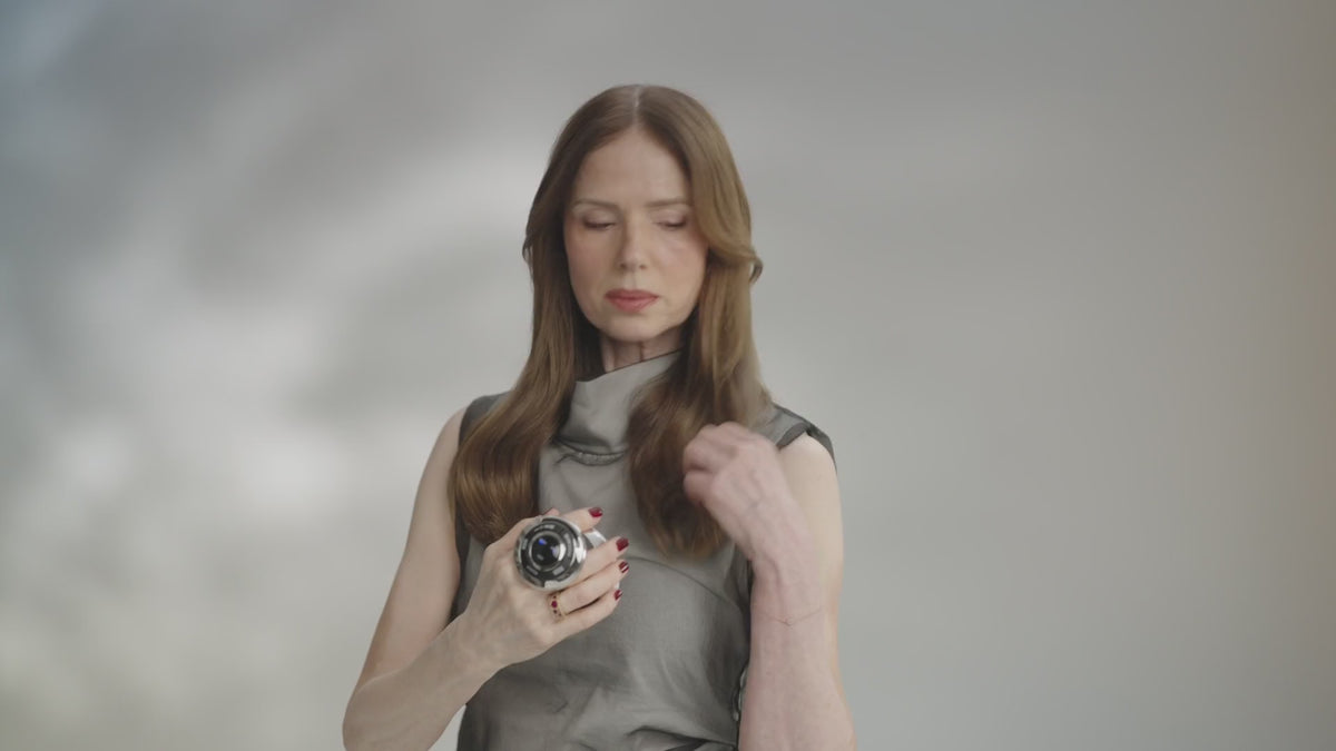 Woman using the chrome Cavispa RF Core PLUS on her upper arm