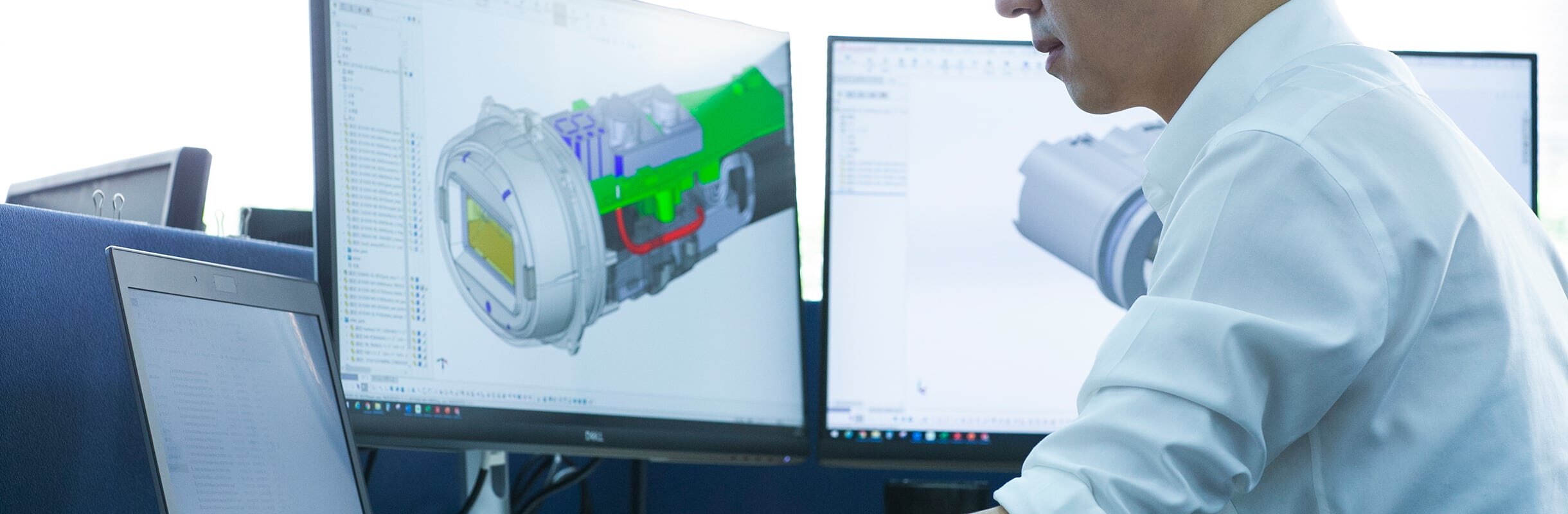 YA-MAN engineer working on a 3D CAD model of a device